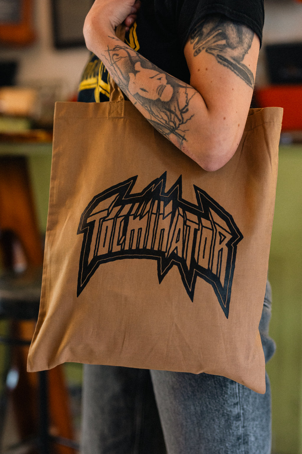 Logotip Tolminator - rjava torba