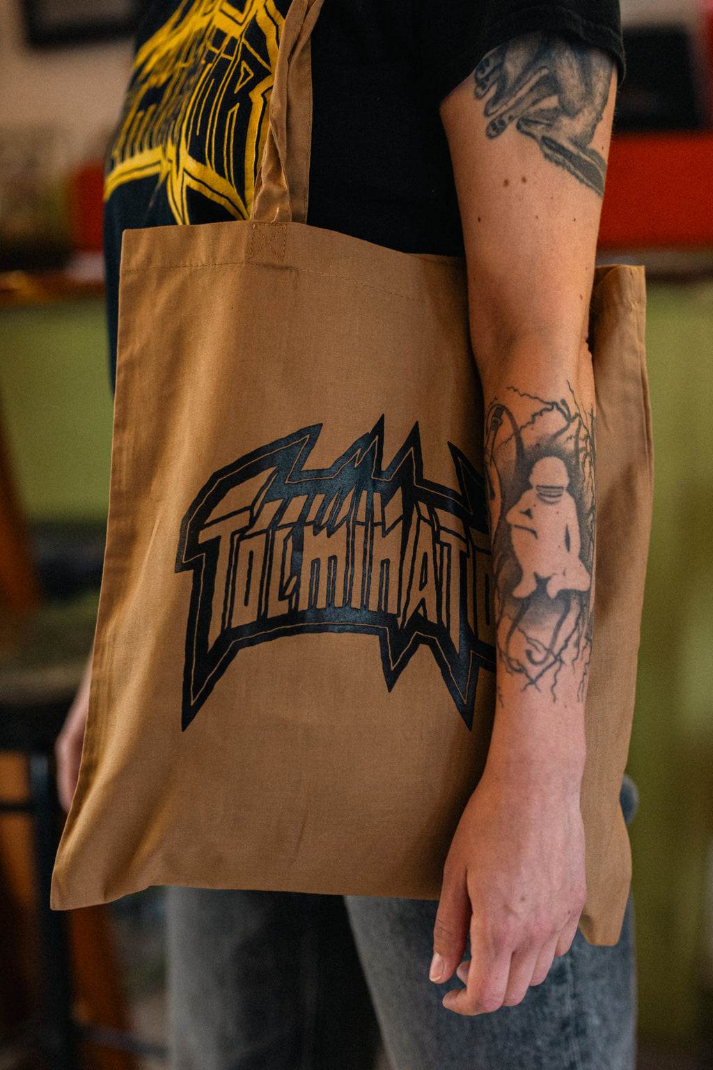 Logotip Tolminator - rjava torba